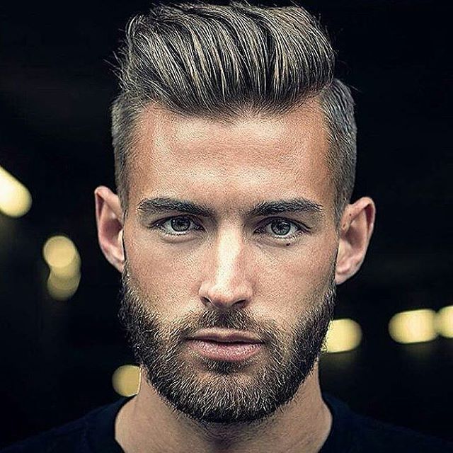 Young man with a swept-back leading-man pompadour and groomed beard